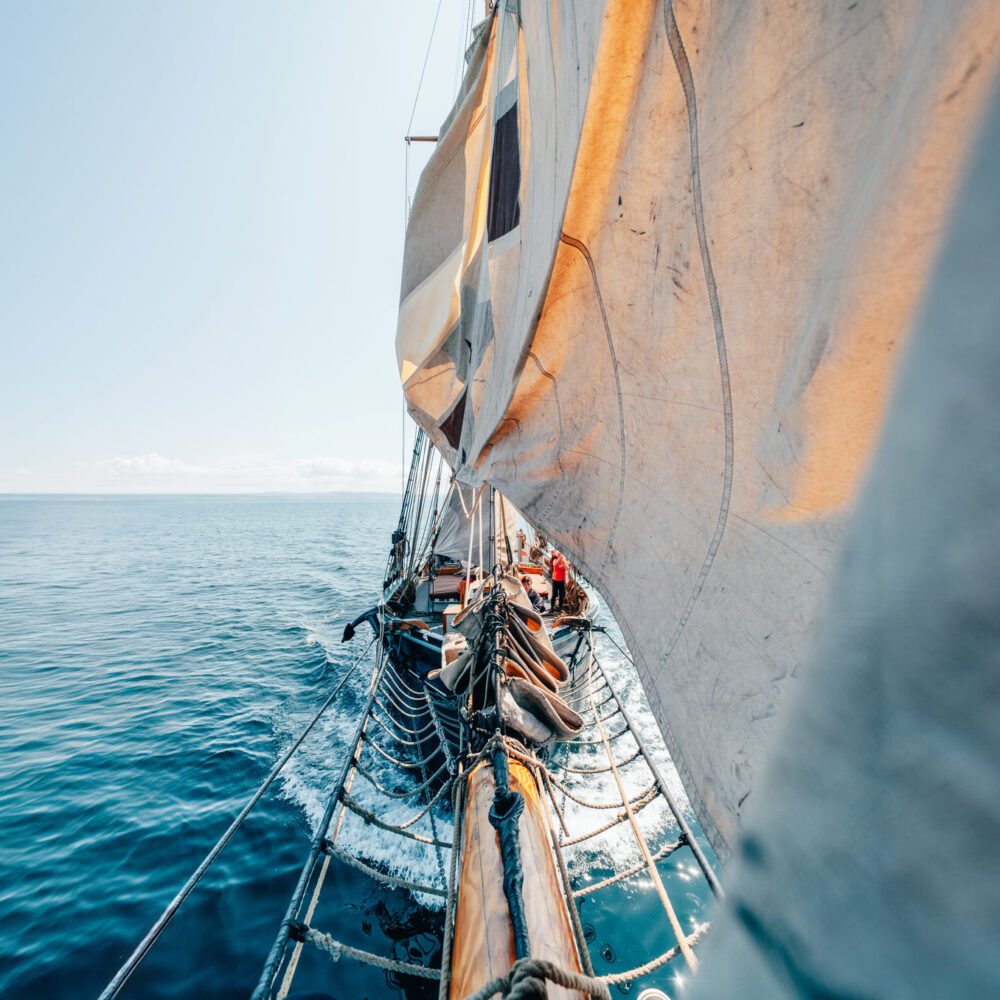 Sat on the bow of a tall ship while they're dropping the sails