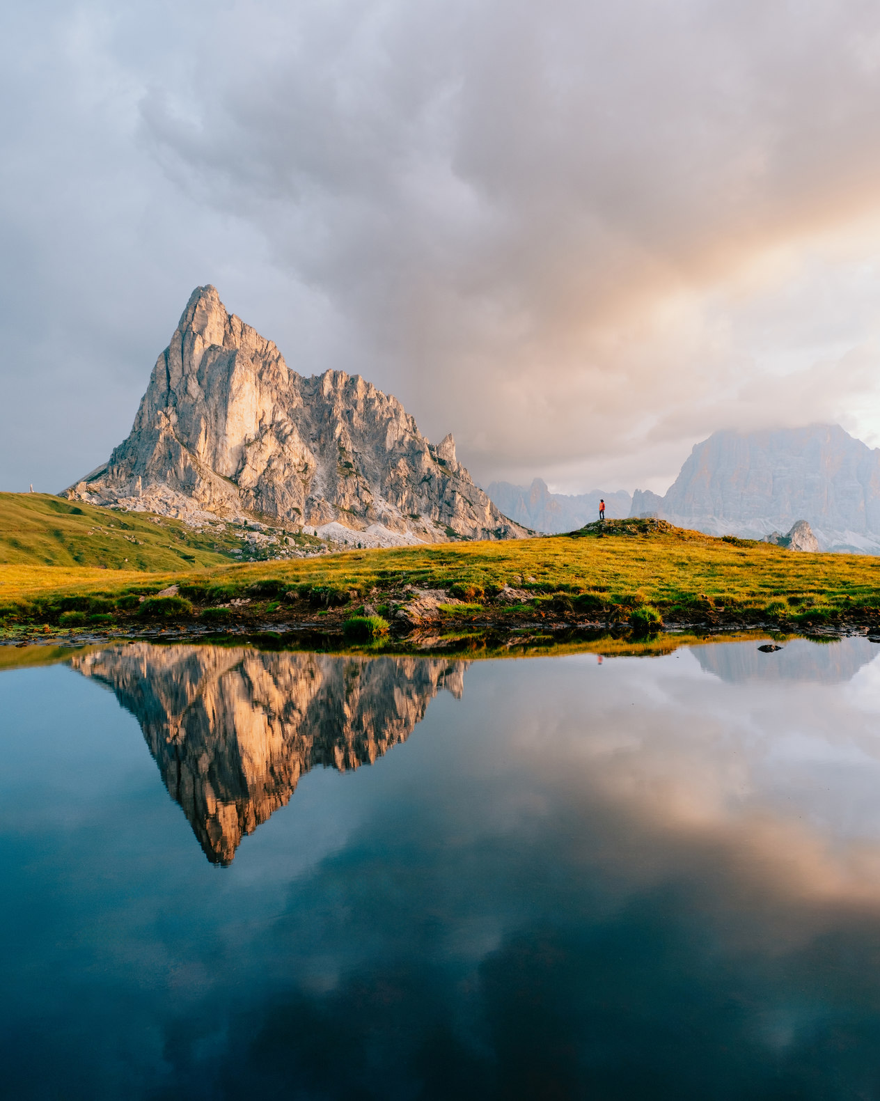 Mountains reflecting in a lake in the Italian dolomites