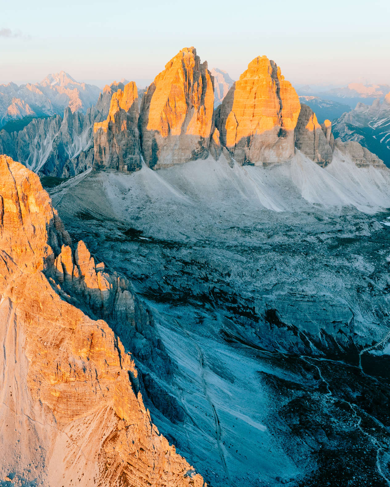 Sun setting on mountain peaks at tre cime di lavaredo