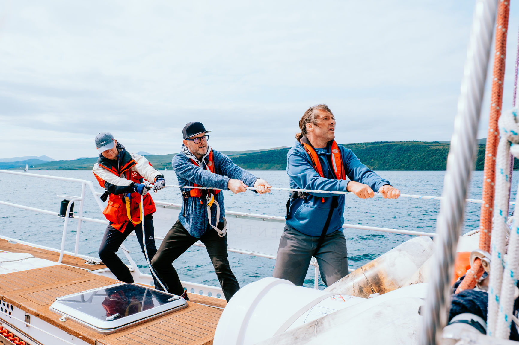 Pulling the sails on a boat at sea
